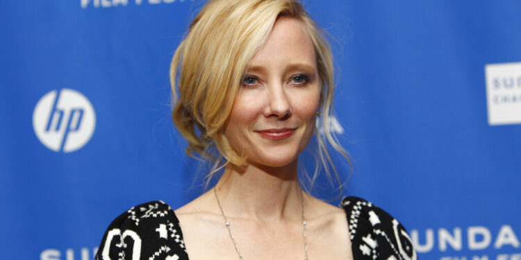 Actress Anne Heche poses at the premiere of "Cedar Rapids" during the 2011 Sundance Film Festival in Park City, Utah on Sunday, Jan. 23, 2011. (AP Photo/Danny Moloshok)